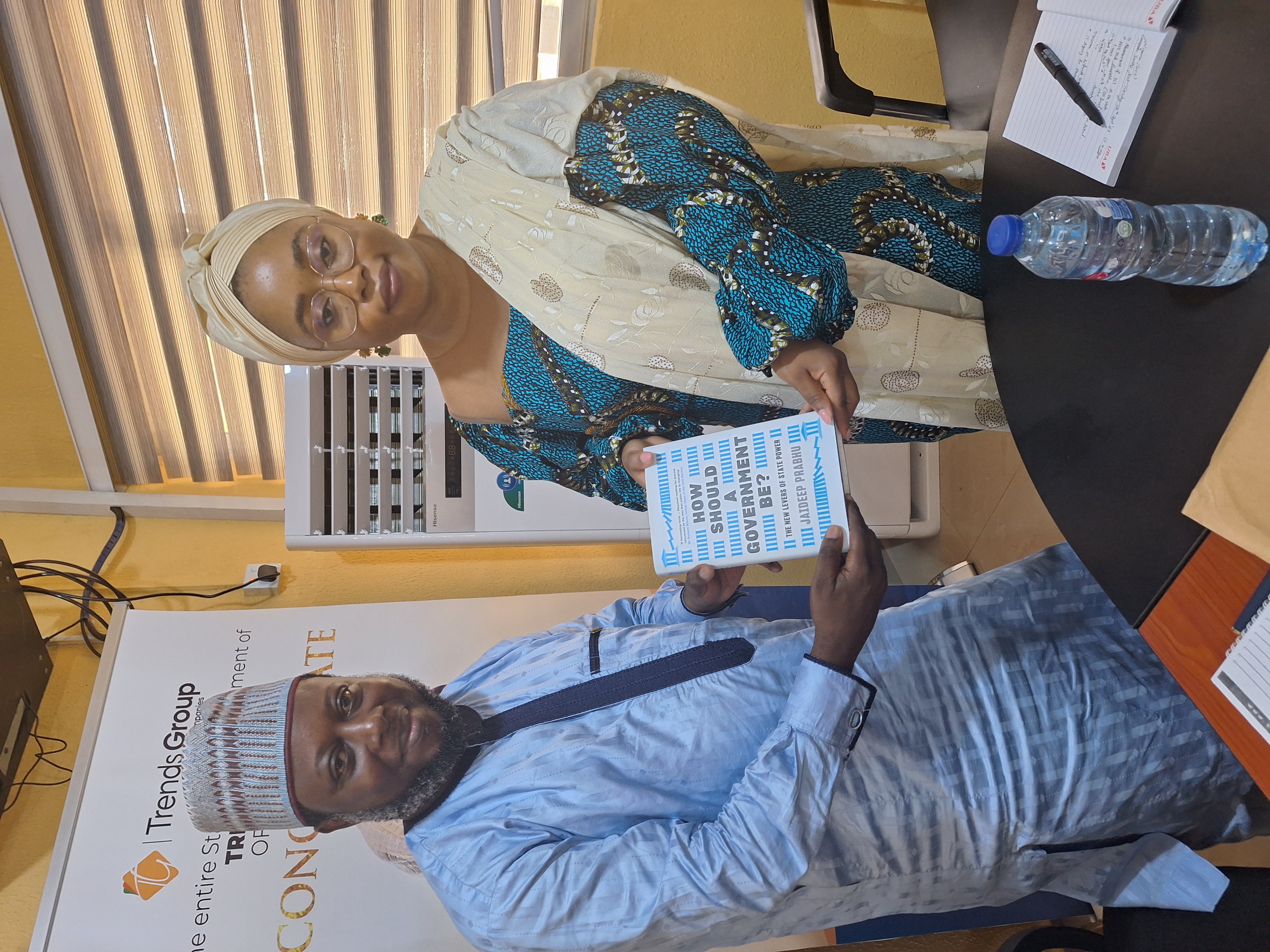 Chairman of Kwara NCS, Engr Taofik Abdulkareem Babaita, presenting a book to the Honourable Commissioner for Business, Innovation, and Technology, Mrs Damilola Yusuf-Adelodun